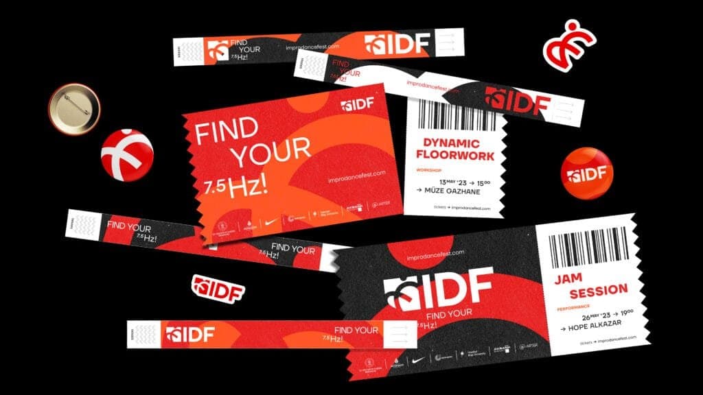 Promotional materials for the Istanbul International Improvisation Dance Festival (IIDF), featuring vibrant red and black designs with the slogan 'Find Your 7.5 Hz!' Items include event tickets, wristbands, buttons, and a flyer for workshops like 'Dynamic Floorwork' and performances such as 'Jam Session,' with bold graphics and barcode details emphasizing the festival's dynamic and energetic branding.