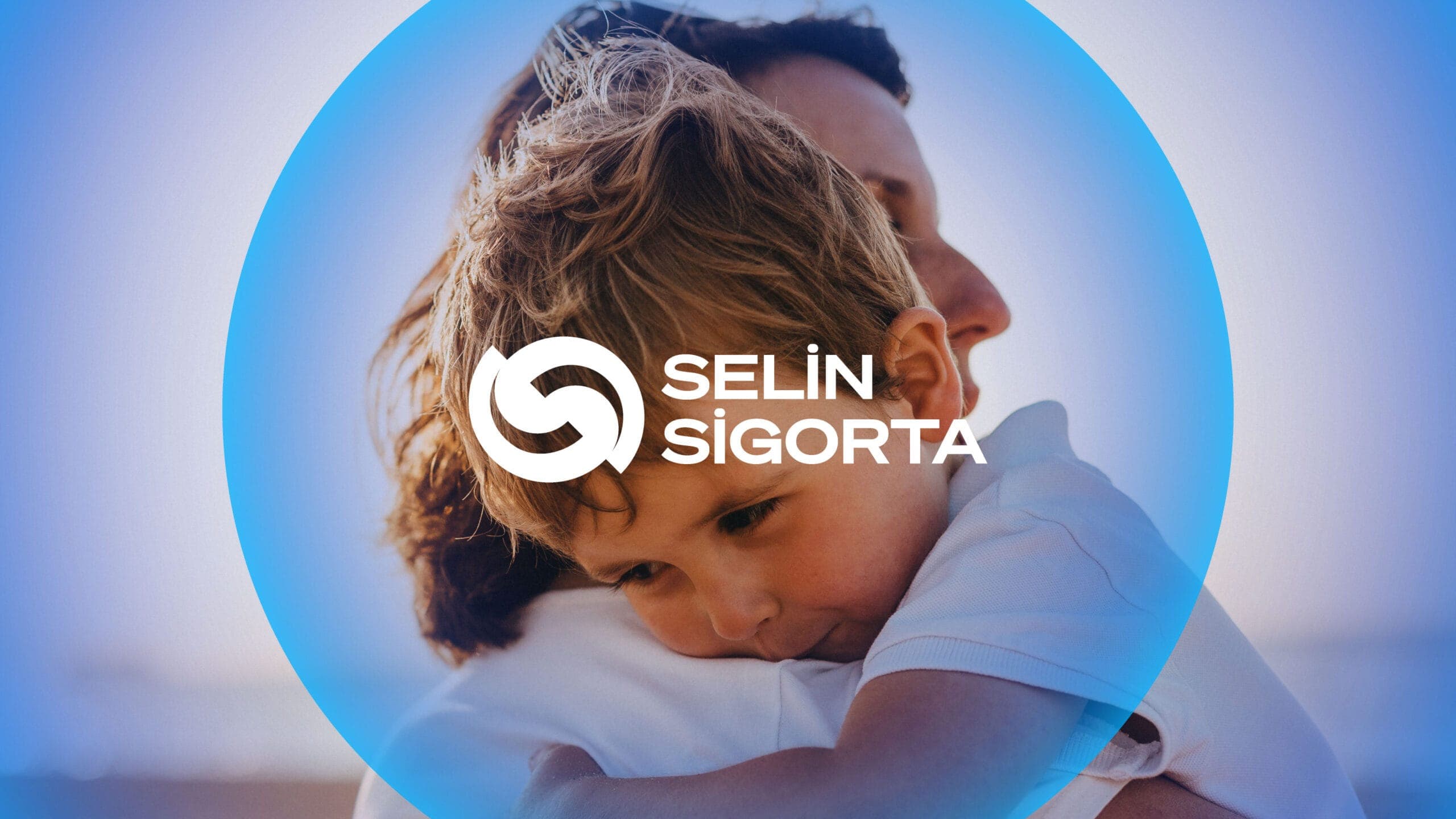 Selin Sigorta logo and branding featuring a child embraced by an adult, enclosed in a glowing blue circular shield that symbolizes protection, with the company name displayed in bold white text.